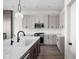 Well-equipped kitchen with modern appliances, white countertops, and a large center island at 17339 Newton Main St, Westfield, IN 46074