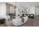 Open concept living space with wood floors, a fireplace, and modern decor at 17339 Newton Main St, Westfield, IN 46074