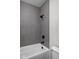 Stylish shower area with vertical mosaic tile surround and matte black fixtures at 17339 Newton Main St, Westfield, IN 46074