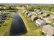 Aerial image of a community next to a pond showing manicured lawns and beautiful landscaping at 18763 Abigail Cir, Westfield, IN 46062