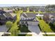Overhead shot of a well-manicured home in a quiet neighborhood; three-car garage and beautiful landscaping at 18763 Abigail Cir, Westfield, IN 46062