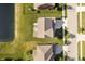 Overhead view of a home's backyard featuring a well-manicured lawn, deck, screened in porch, and hot tub at 18763 Abigail Cir, Westfield, IN 46062