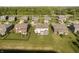 Aerial view of homes featuring yards and landscaping near a pond at 18763 Abigail Cir, Westfield, IN 46062