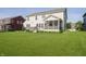 Spacious backyard featuring a well-maintained lawn, deck, screened in porch and hot tub, great for outdoor relaxation at 18763 Abigail Cir, Westfield, IN 46062