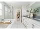 Bright, airy bathroom with white cabinets, double sinks, and a walk-in shower at 18763 Abigail Cir, Westfield, IN 46062