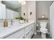 Bathroom with a double sink vanity, neutral walls, and modern fixtures, complemented by stylish decor at 18763 Abigail Cir, Westfield, IN 46062