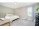 Cozy bedroom featuring a comfortable bed, natural light from the window, and a neutral color palette at 18763 Abigail Cir, Westfield, IN 46062