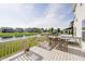 Scenic deck with dining furniture, offering beautiful views of the backyard, pond and neighborhood at 18763 Abigail Cir, Westfield, IN 46062
