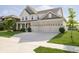 Beautiful two-story home boasts a wide driveway leading to a three-car garage and well-kept landscaping at 18763 Abigail Cir, Westfield, IN 46062