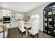 Bright kitchen showcasing a dining area, modern appliances, ample cabinet space, and stylish decor at 18763 Abigail Cir, Westfield, IN 46062