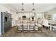 Stylish kitchen offers an island with barstool seating, stainless steel appliances, and elegant pendant lighting at 18763 Abigail Cir, Westfield, IN 46062