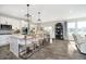 Bright, modern kitchen features a large island with seating, stainless steel appliances, and sleek cabinetry at 18763 Abigail Cir, Westfield, IN 46062