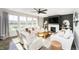 Bright living room features comfortable seating, large windows, and a modern fireplace, creating a welcoming atmosphere at 18763 Abigail Cir, Westfield, IN 46062
