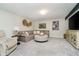 Comfortable living room with a plush sectional sofa, cozy armchair, and stylish decor at 18763 Abigail Cir, Westfield, IN 46062