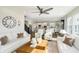 Bright open-concept living room with lots of natural light and views into the kitchen area at 18763 Abigail Cir, Westfield, IN 46062