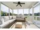 Inviting screened porch with comfortable seating, a ceiling fan, and scenic views of the neighborhood at 18763 Abigail Cir, Westfield, IN 46062