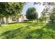 Expansive backyard featuring lush lawn, mature trees, and a charming screened-in porch perfect for outdoor enjoyment at 197 Ceejay Dr, Greenwood, IN 46142