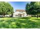 Backyard featuring a large lawn and mature trees at 197 Ceejay Dr, Greenwood, IN 46142