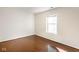 Empty bedroom with hardwood floors and a window at 197 Ceejay Dr, Greenwood, IN 46142