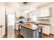 Bright kitchen with stainless steel appliances, a center island, and white cabinetry at 197 Ceejay Dr, Greenwood, IN 46142