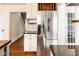 Modern kitchen with stainless steel refrigerator, wine rack, and marble countertops at 197 Ceejay Dr, Greenwood, IN 46142