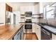 Well-equipped kitchen with stainless steel appliances, white cabinets, and a butcher block island at 197 Ceejay Dr, Greenwood, IN 46142