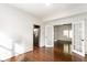 Spacious living room featuring hardwood floors, stainless steel refrigerator, and french doors at 197 Ceejay Dr, Greenwood, IN 46142