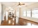 Spacious living room featuring hardwood floors, white walls, and natural light from the large windows at 197 Ceejay Dr, Greenwood, IN 46142