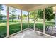 Screened porch with views of the manicured lawn at 197 Ceejay Dr, Greenwood, IN 46142