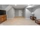 Basement area with laminate flooring, access to the upper floor via stairs, and closet space at 2075 Rhettsbury St, Carmel, IN 46032