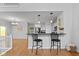 Bright, modern kitchen with breakfast bar overlooking the living and dining areas at 2075 Rhettsbury St, Carmel, IN 46032