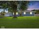 Charming single-story home with beautiful lawn, mature shade tree, and well-maintained front exterior at 2233 S Miller Ave, Shelbyville, IN 46176