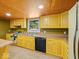Bright kitchen featuring a window over the sink, black appliances, and wood countertops at 2233 S Miller Ave, Shelbyville, IN 46176