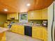 Bright kitchen featuring a window over the sink, black appliances, and wood countertops at 2233 S Miller Ave, Shelbyville, IN 46176
