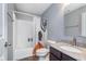This bathroom features neutral paint, a granite countertop, and a shower and tub combo at 2436 Gwinnett St, Carmel, IN 46032