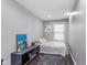 Modern bedroom with neutral tones, dark floors, a comfortable bed, and natural light at 2436 Gwinnett St, Carmel, IN 46032