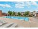 Relaxing community pool with lounge chairs and beautiful view of the neighborhood buildings at 2436 Gwinnett St, Carmel, IN 46032