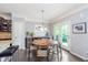 Bright dining area with bar and drink fridge, chandelier and access to patio at 2436 Gwinnett St, Carmel, IN 46032