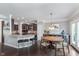 Bright and airy dining area adjacent to kitchen featuring a decorative chandelier at 2436 Gwinnett St, Carmel, IN 46032