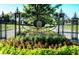 Ornate metal gate and entrance to Village West Clay with landscaping at 2436 Gwinnett St, Carmel, IN 46032