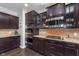 Spacious kitchen featuring stainless appliances, granite countertops and dark wood cabinetry at 2436 Gwinnett St, Carmel, IN 46032