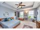 This spacious main bedroom features a ceiling fan, two windows, and neutral paint at 2436 Gwinnett St, Carmel, IN 46032