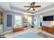 Neutral paint and carpet add to this spacious main bedroom, with ceiling fan and natural light at 2436 Gwinnett St, Carmel, IN 46032