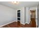 Bright bedroom with wood flooring, neutral walls, and a closet for ample storage at 2519 N Boehning St, Indianapolis, IN 46219