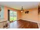 Dining area with sliding glass doors leading to the backyard and stylish light fixture at 2519 N Boehning St, Indianapolis, IN 46219