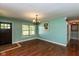 Well-lit dining room with hardwood floors and a charming chandelier at 2519 N Boehning St, Indianapolis, IN 46219