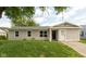 Charming single-story home with a well-maintained lawn and inviting front entrance at 2519 N Boehning St, Indianapolis, IN 46219