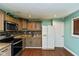 Functional kitchen with modern appliances, granite countertops, and ample cabinet space at 2519 N Boehning St, Indianapolis, IN 46219