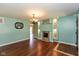 Bright living room with hardwood floors, stone fireplace, and recessed lighting at 2519 N Boehning St, Indianapolis, IN 46219