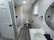 Updated bathroom features stylish tiling in the shower, vanity, and a modern toilet at 2911 E 35Th St, Indianapolis, IN 46218